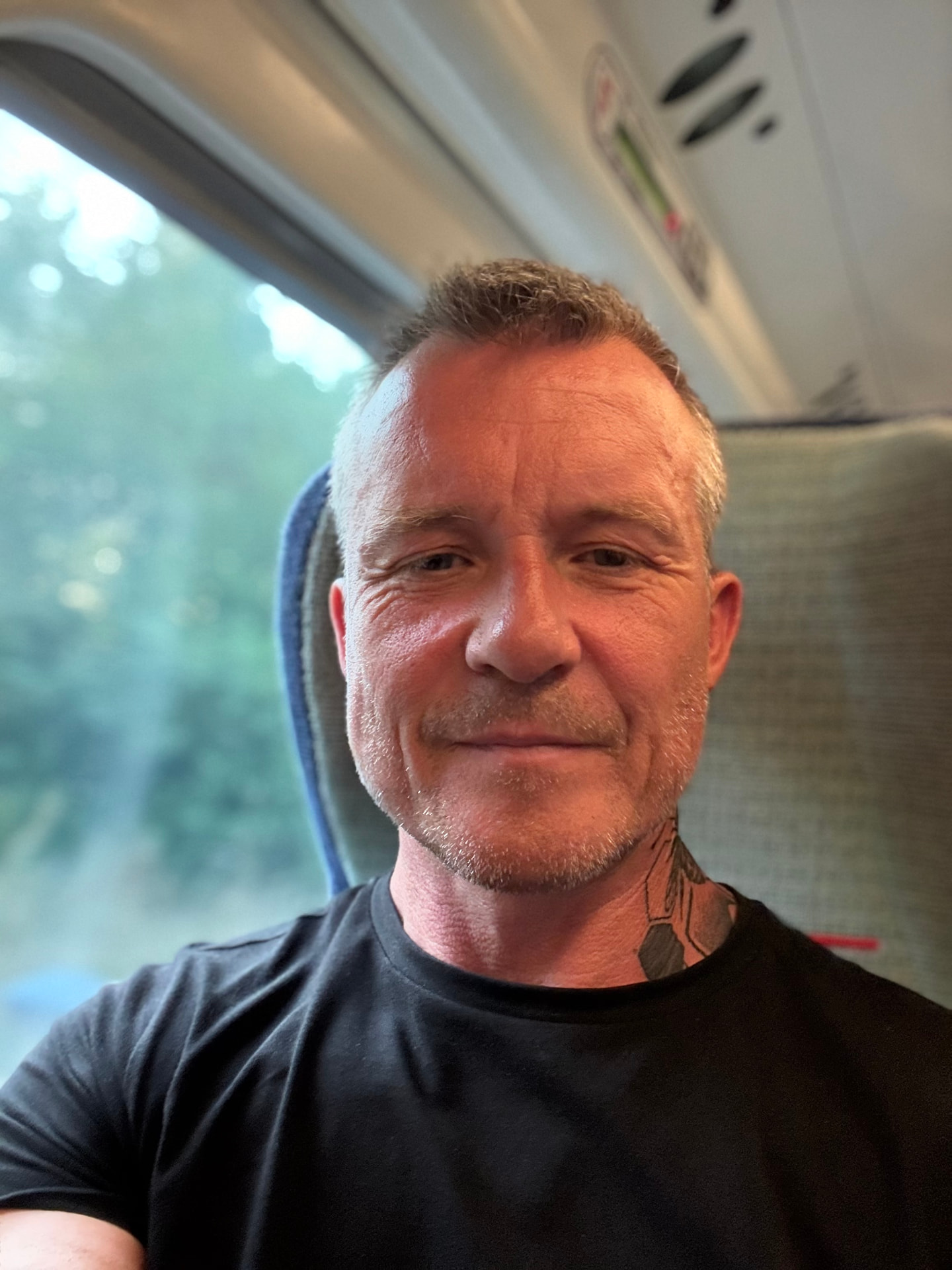 Jake, the person behind VeganFit, on a train