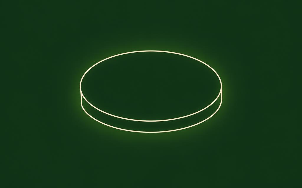 One line drawing of a round coaster with the VeganFit logo on the face